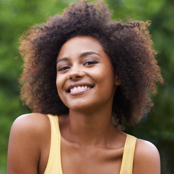 woman smiling outdoors