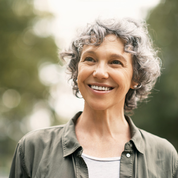 mature woman smiling outdoors