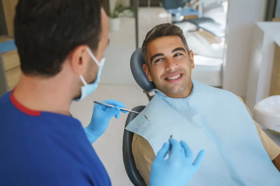 Dentist discussing dental crown procedure with patient in a clinic in Pittsburgh, PA Metro Area