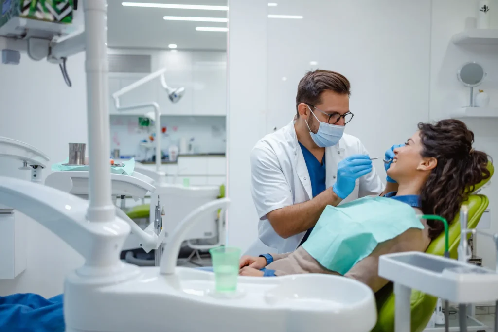 Dentist examining a patient’s teeth in a clinic in the Pittsburgh, PA Metro Area
