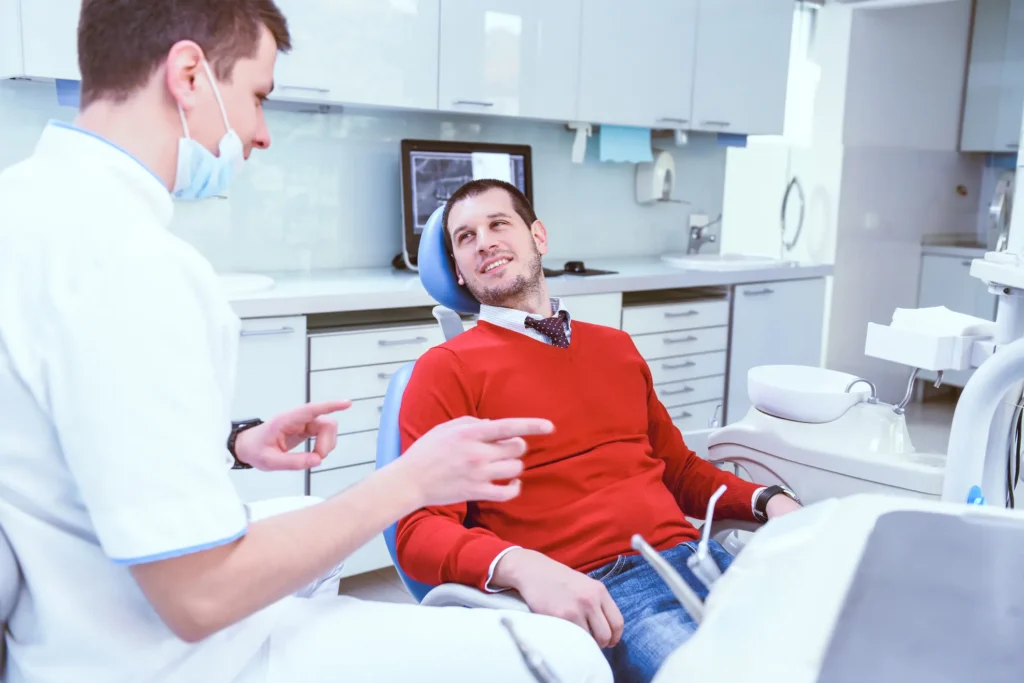Dentist explaining procedure to patient during first dental visit in Pittsburgh, PA Metro Area