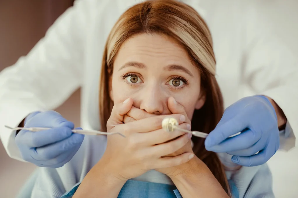 Patient undergoing gum disease evaluation by a dentist in a clinical setting in Pittsburgh, PA