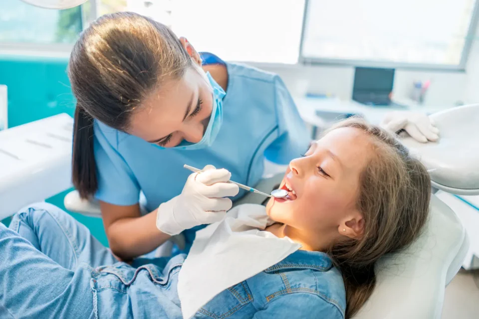 Dental professional examining a patient’s teeth during an orthodontic consultation in Pittsburgh, PA