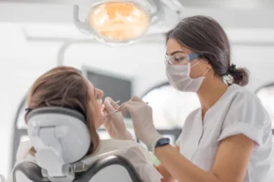 A dental professional performing a procedure to transform a smile in Pittsburgh, PA